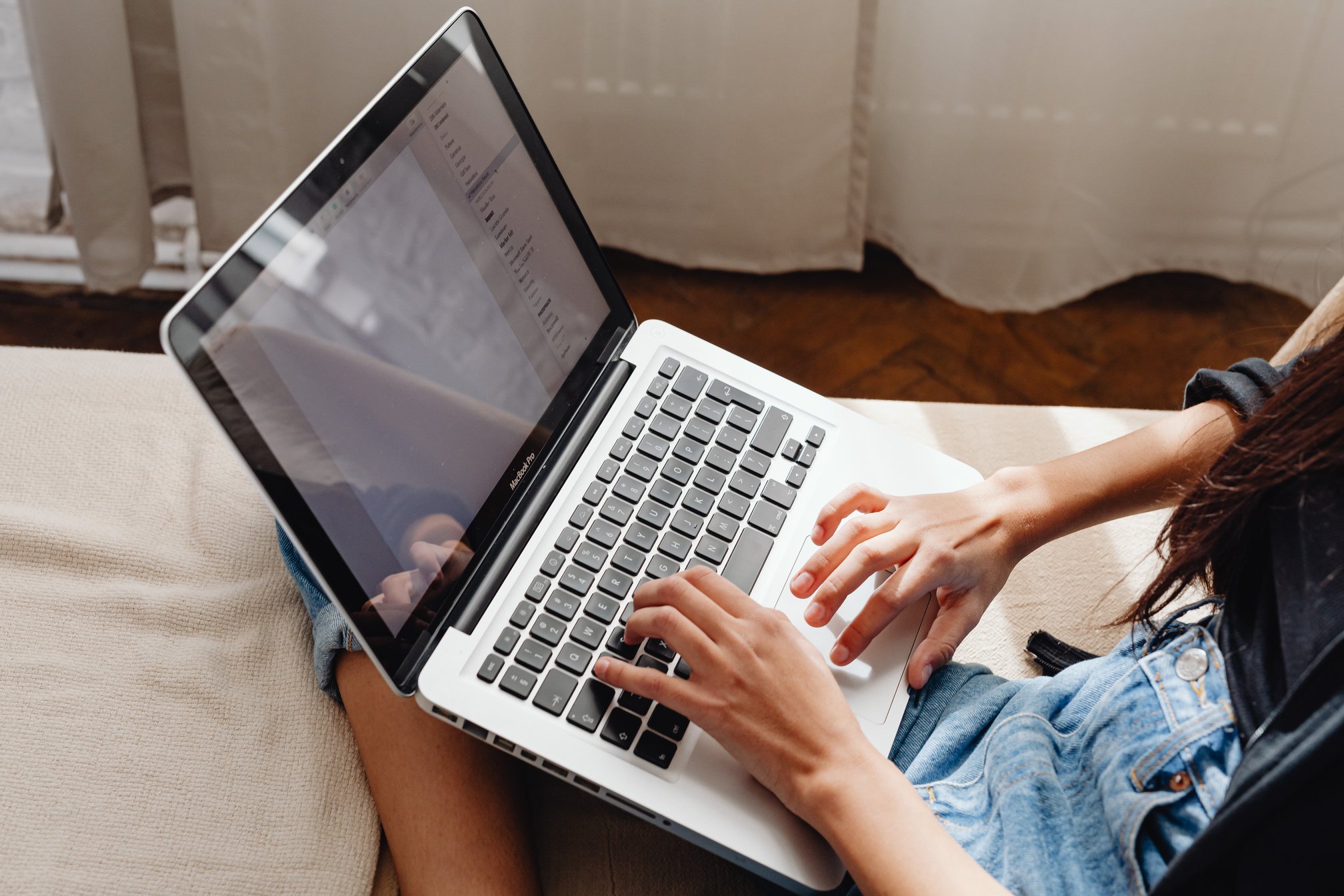 Person Browsing on a Laptop Computer